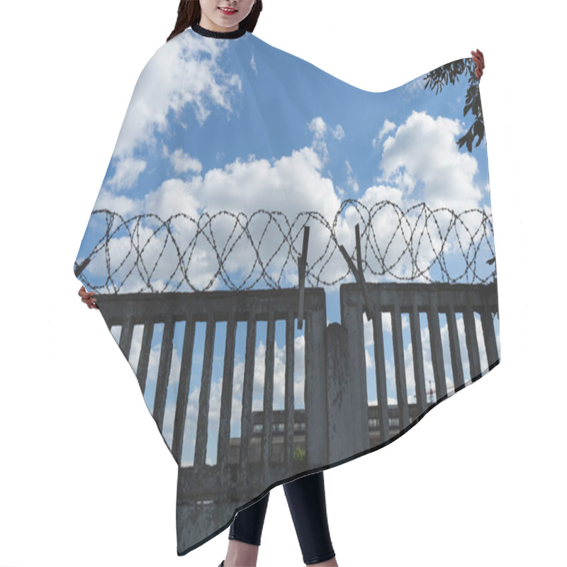 Personality  Barbed Wire On A Concrete Fence Against A Blue Sky. Protected Area. Hair Cutting Cape