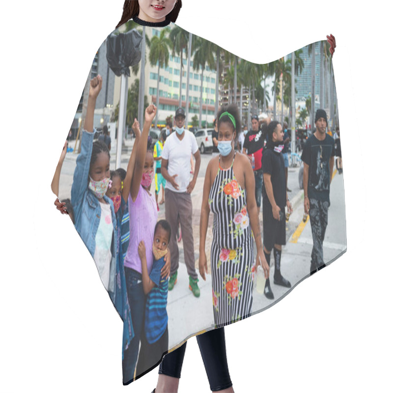 Personality  Miami, FL, USA - JUNE 7, 2020: Black Mom With Children On Demonstrations In The USA And Protests Against Racism After The George Floyd Death. Hair Cutting Cape