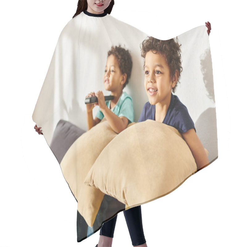 Personality  Focus On Merry African American Boy With Pillow Watching TV Next To His Blurred Adorable Brother Hair Cutting Cape