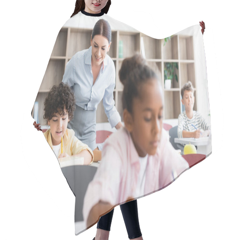 Personality  Selective Focus Of Teacher Standing Beside Multicultural Pupils In Classroom  Hair Cutting Cape