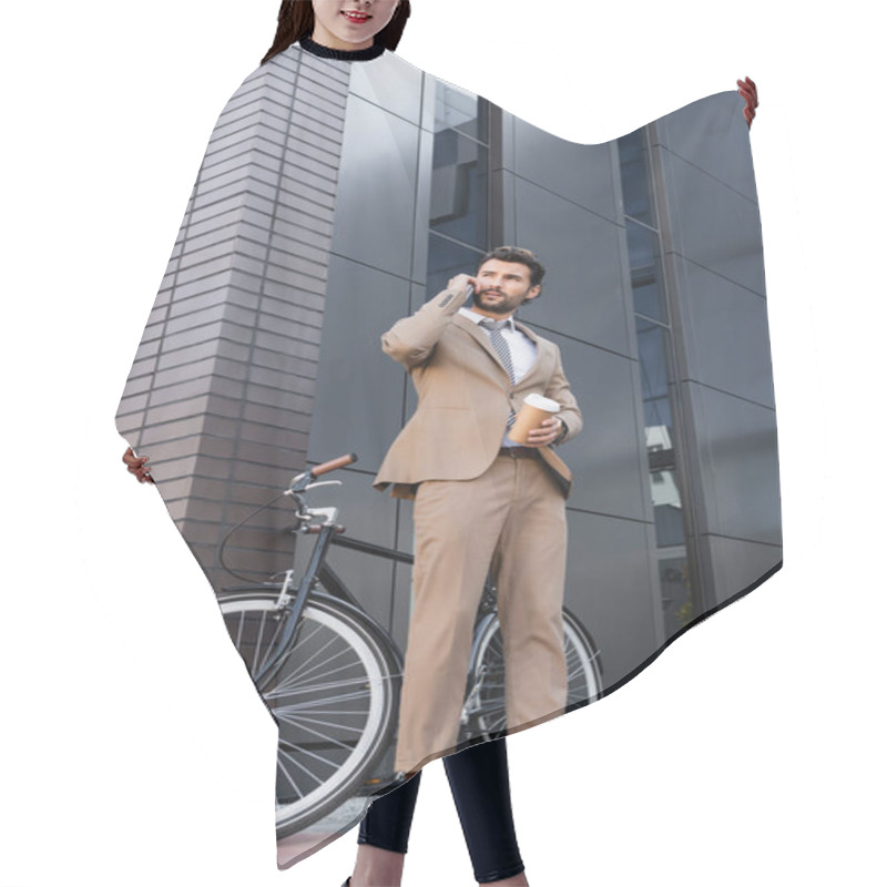 Personality  Low Angle View Of Businessman Talking On Smartphone And Holding Paper Cup Near Bicycle And Building  Hair Cutting Cape