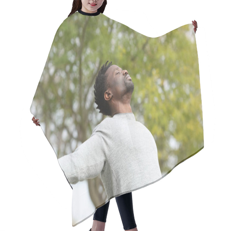 Personality  Black Man Breathing Fresh Air Stretching Arms In A Park With A Green Tree In The Background Hair Cutting Cape