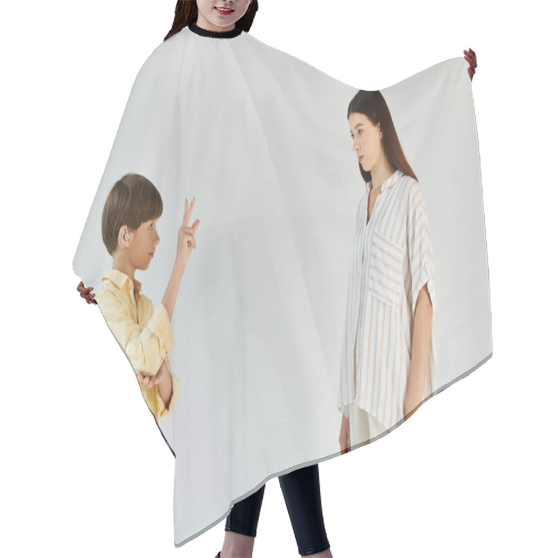 Personality  A Little Boy Using Sign Language Engages In A Heartfelt Conversation With His Mother. Hair Cutting Cape