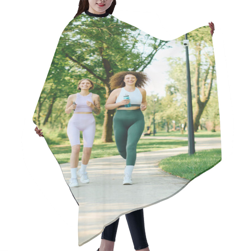 Personality  Two Women Share Laughter While Jogging On A Scenic Park Path. Hair Cutting Cape