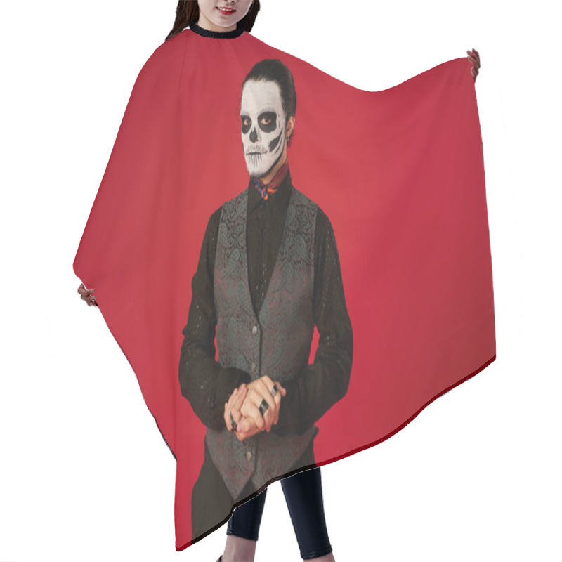 Personality  Elegant Man In Eerie Dia De Los Muertos Skull Makeup Looking At Camera On Red, Mexican Tradition Hair Cutting Cape