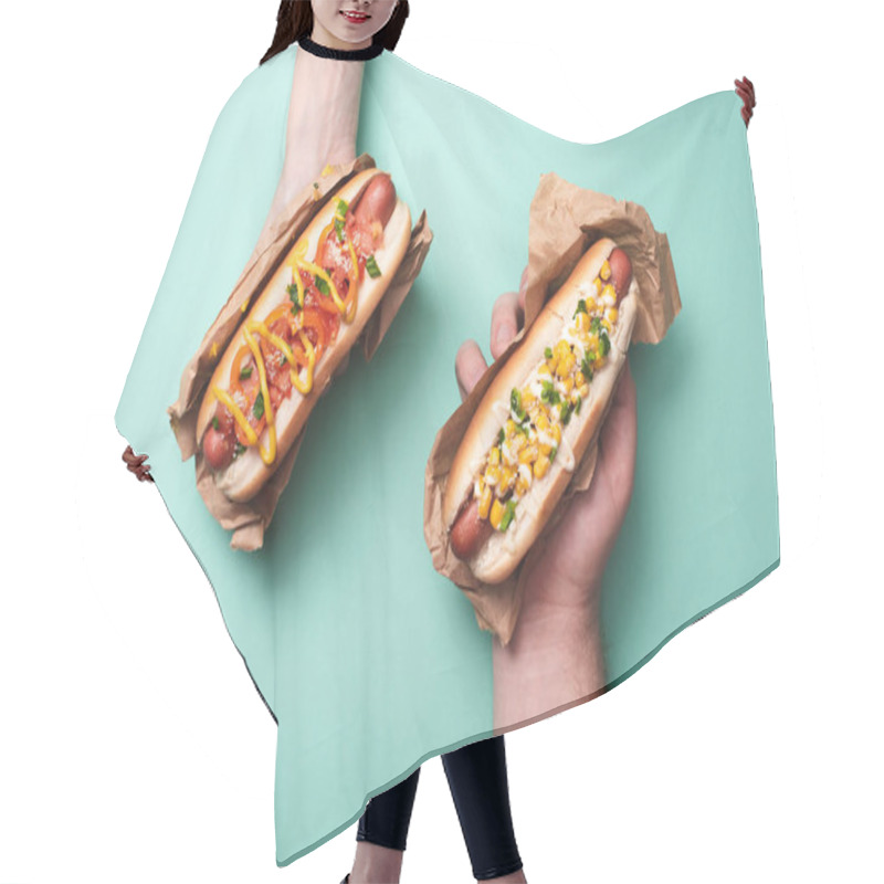 Personality  Cropped View Of Man And Woman Holding Two Tasty Hot Dogs In Paper On Blue Hair Cutting Cape