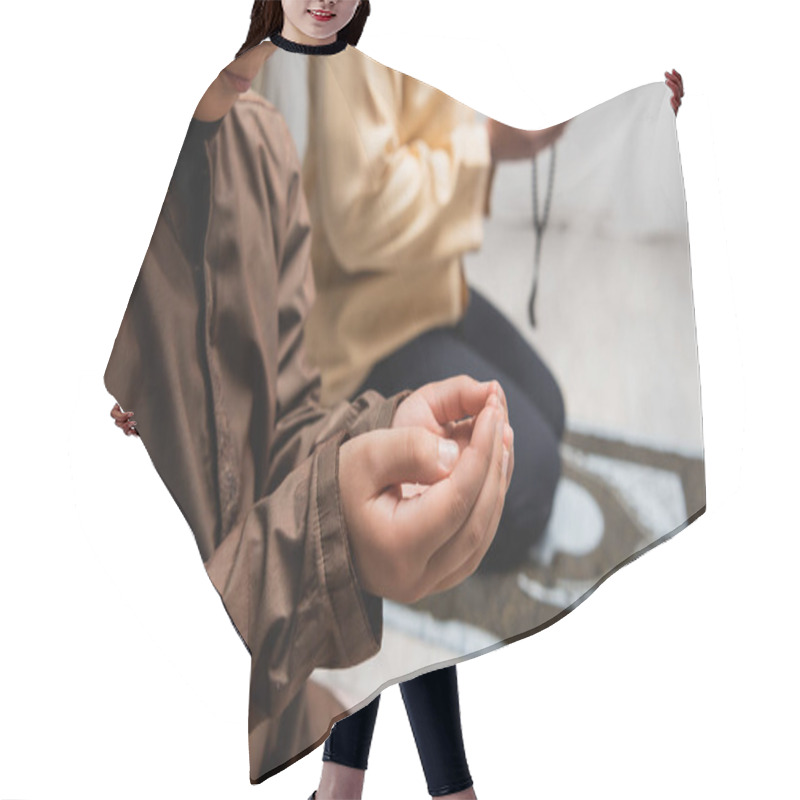 Personality  Cropped View Of Muslim Boy Praying During Salah Near Blurred Dad At Home  Hair Cutting Cape