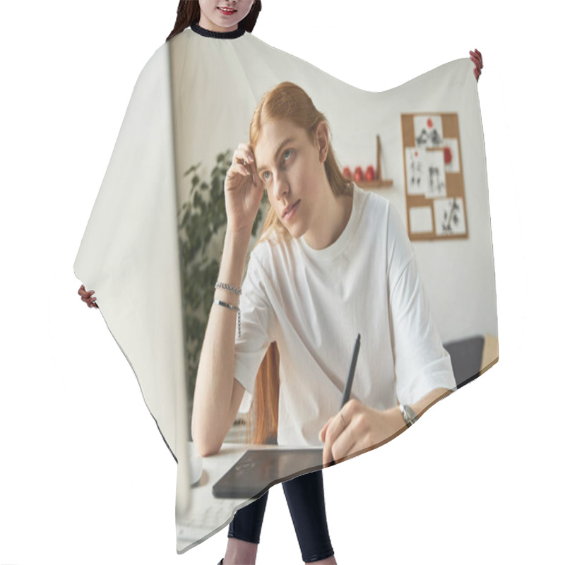 Personality  A Young Man Thoughtfully Illustrates On A Tablet In A Bright, Contemporary Office Setting. Hair Cutting Cape