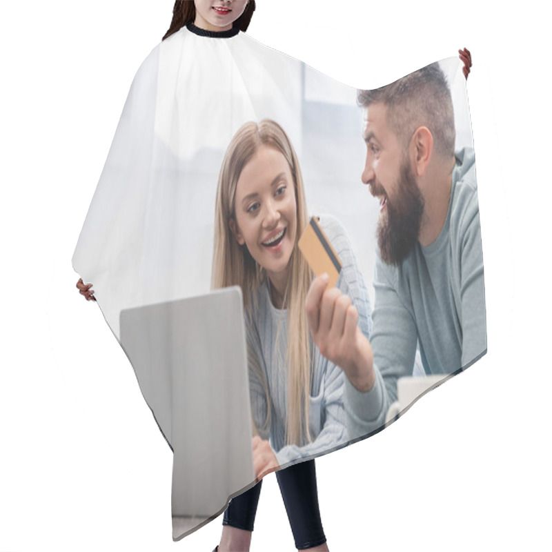 Personality  Cheerful Family Lying On Floor With Laptop And Shopping Online Hair Cutting Cape