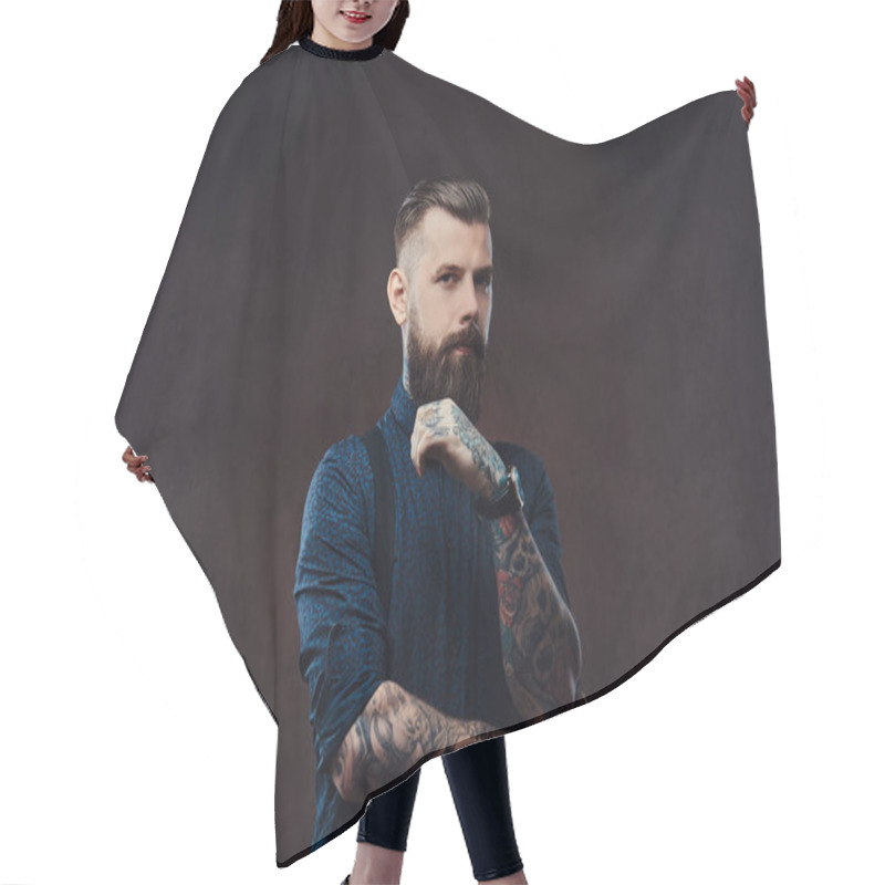 Personality  Pensive Handsome Old-fashioned Hipster In A Blue Shirt And Suspenders, Standing With Hand On Chin In A Studio. Isolated On A Dark Background. Hair Cutting Cape