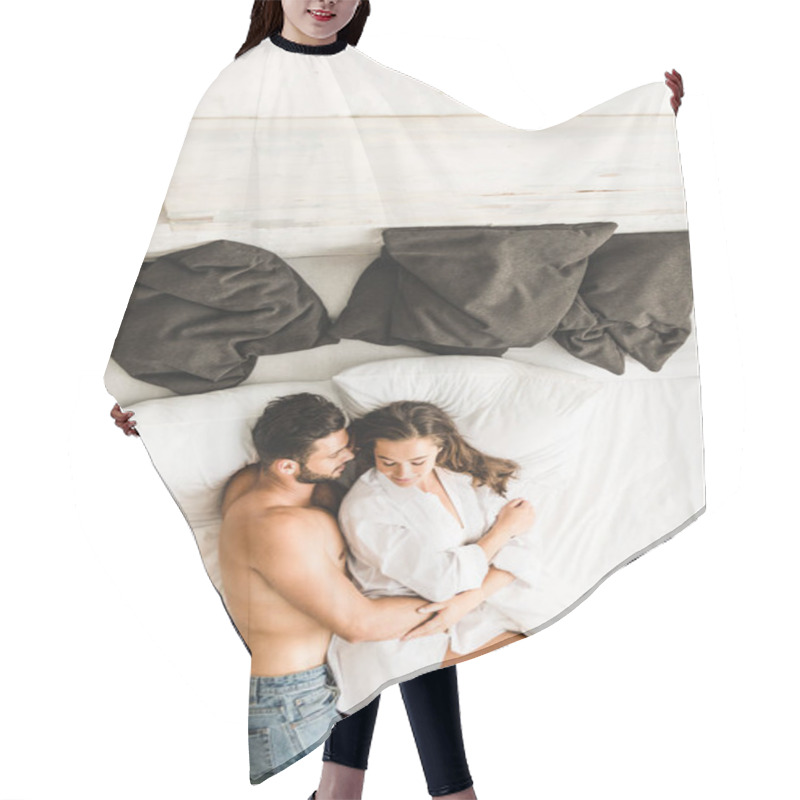 Personality  Top View Of Sexy Couple Lying On Bed While Man Hugging Girl From Back Hair Cutting Cape