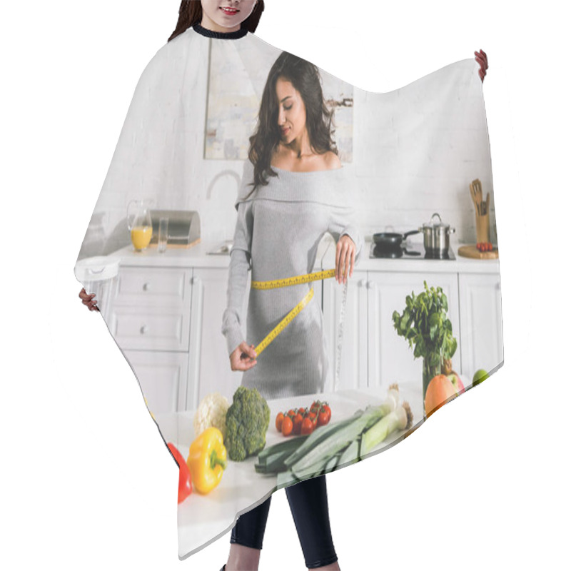 Personality  Attractive Woman Measuring Waist Near Fruits And Vegetables On Table   Hair Cutting Cape