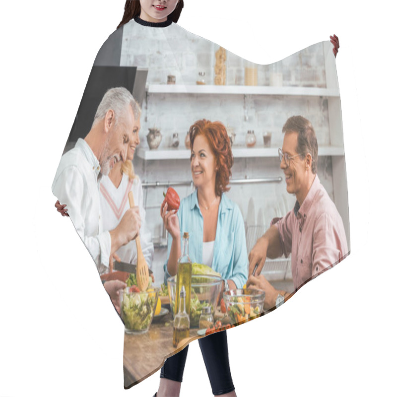 Personality  Smiling Mature Friends Preparing Salad For Dinner And Talking At Home Hair Cutting Cape