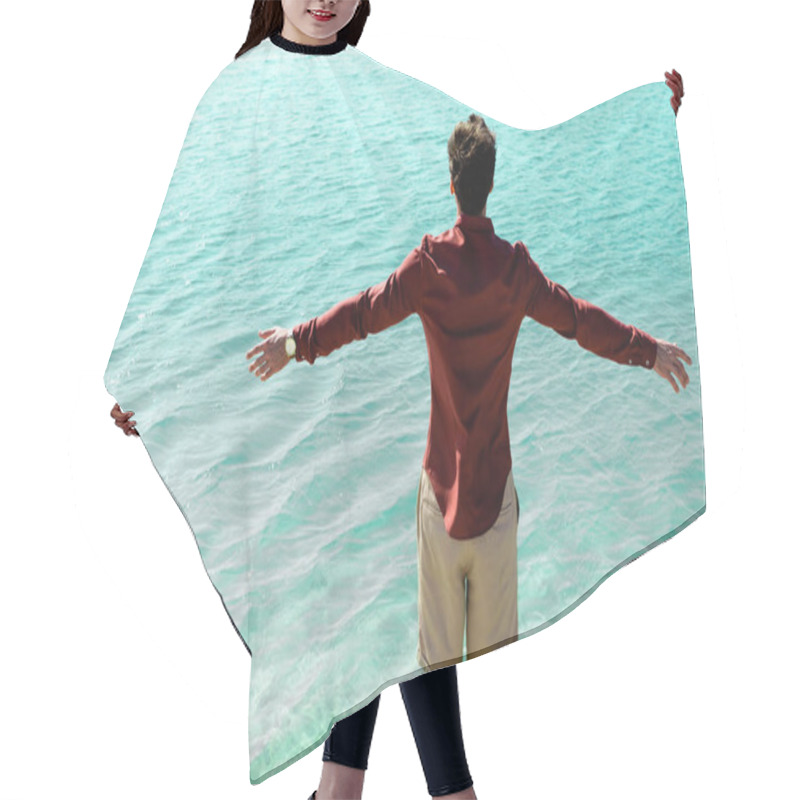 Personality  Back View Of Man With Outstretched Hands Standing In Turquoise Water Hair Cutting Cape