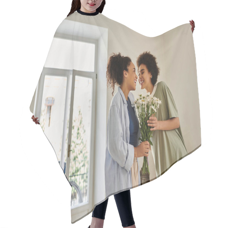 Personality  A Loving Couple Shares A Tender Moment While Holding Daisies By The Window. Hair Cutting Cape