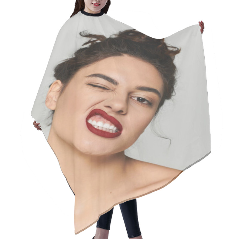 Personality  Beautiful Woman With Striking Red Lips Making A Playful Face In A Simple Studio Backdrop Hair Cutting Cape