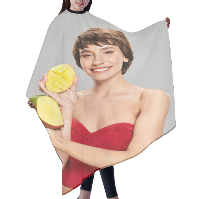 Personality  A Young Woman In A Red Top Holding Mangos. Hair Cutting Cape