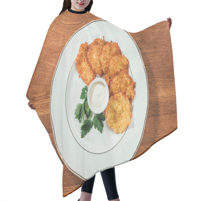 Personality  Top View Of Fried Potato Cutlets  With Sauce In Saucer On Plate Over Wooden Surface  Hair Cutting Cape