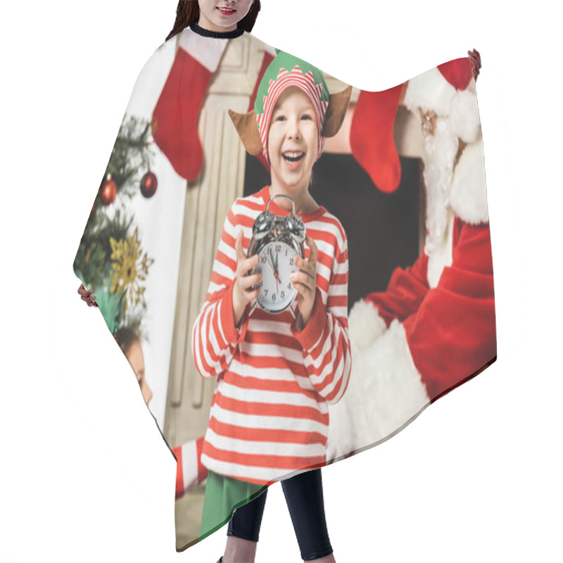 Personality  Adorable Little Kid Holding Alarm Clock With His Sister And Santa Passing Gift Box On Background Hair Cutting Cape