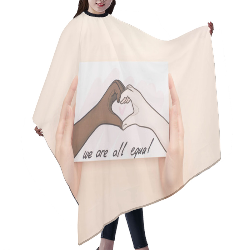 Personality  Cropped View Of Woman Holding Picture With Drawn Multiethnic Hands Showing Heart Gesture On Beige Background Hair Cutting Cape