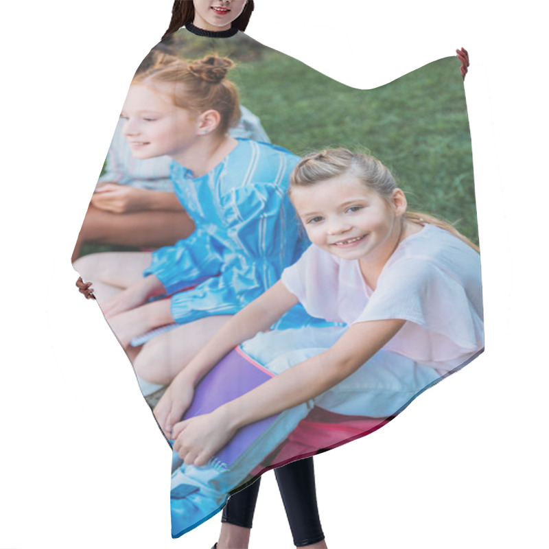 Personality  Group Of Adorable Schoolgirls Sitting On Grass Together Hair Cutting Cape