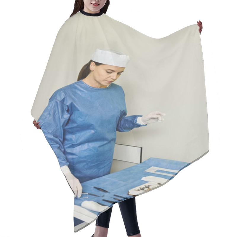 Personality  A Woman In A Hospital Gown Is Manipulating An Operating Table In A Clinical Setting. Hair Cutting Cape