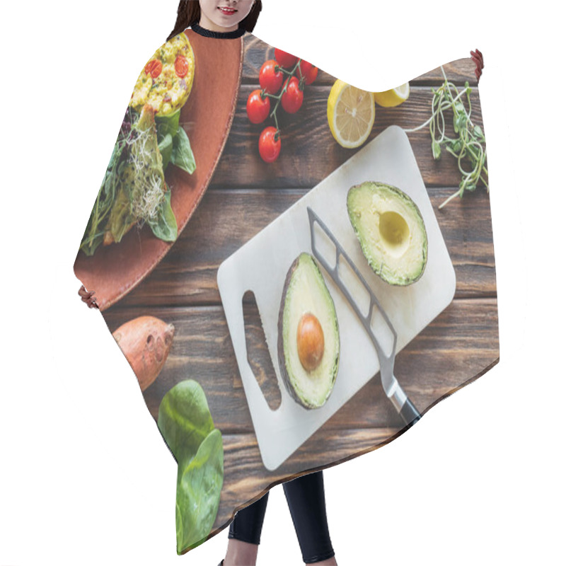 Personality  Flat Lay With Vegetarian Salad, Cut Avocado On Cutting Board, Knife And Fresh Vegetables Around On Wooden Tabletop Hair Cutting Cape