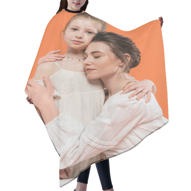 Personality  Motherly Love, Young Woman Embracing Her Daughter On Orange Background, Closed Eyes, Modern Parenting, Family Fashion, White Sun Dresses, Togetherness, Love, Female Bonding  Hair Cutting Cape