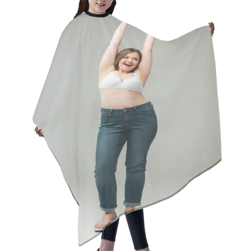 Personality  Happy Plus Size Woman In Jeans And Bra Standing With Hands Above Head On Scales And Smiling On Grey Hair Cutting Cape