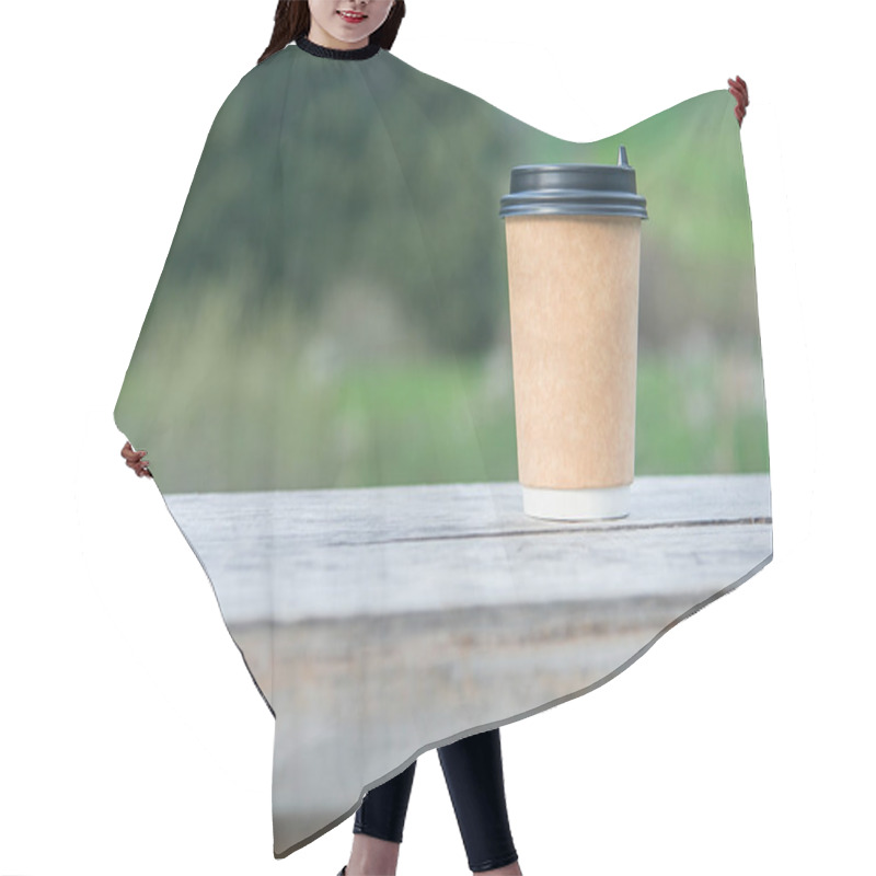 Personality  Close-up Paper Cup Of Coffee On Natural Background On A Wooden Bench. For A Coffee Shop. Hair Cutting Cape