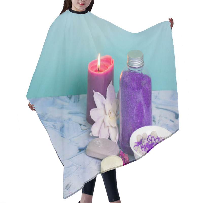 Personality  Composition With A Jar Of Purple Lavender Sea Salt, Soap Bar, Burning Lilac Candle And Beautiful Flower. Spa Procedure, Body, Facial Care. Cosmetic Products. Bathing Treatments In A Beauty Salon. Hair Cutting Cape