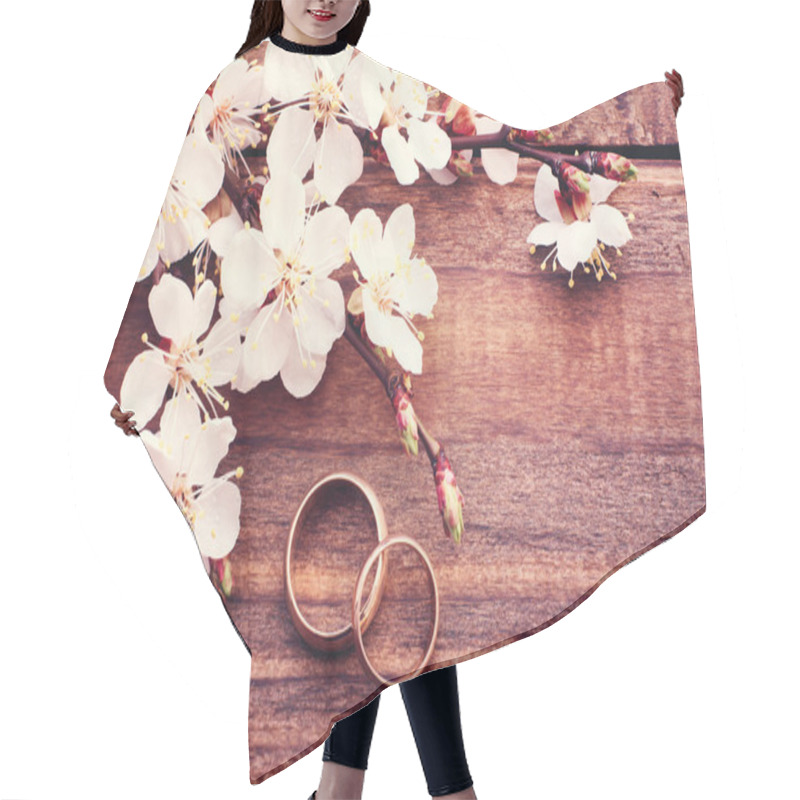 Personality  Wedding Rings. Flowering Branch Flowers On Wooden Surface. Hair Cutting Cape