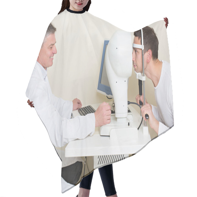 Personality  Man Having His Eyes Examined By An Eye Elderly Doctor. Hair Cutting Cape