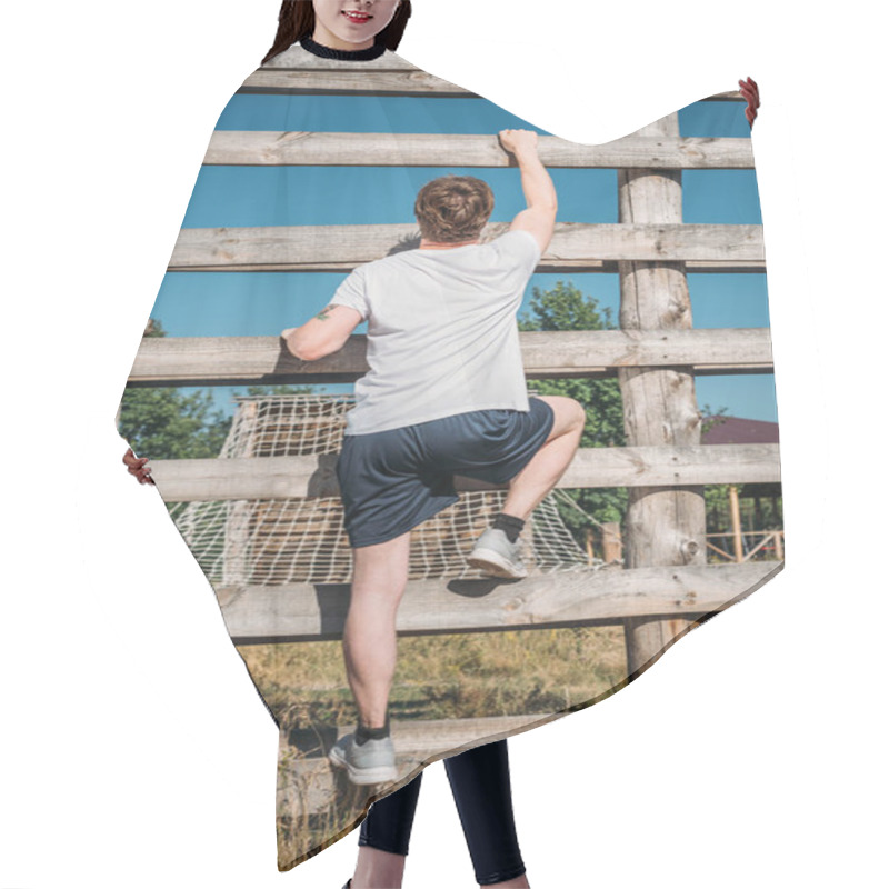 Personality  Back View Of Soldier Climbing Wooden Barrier During Obstacle Run On Range Hair Cutting Cape