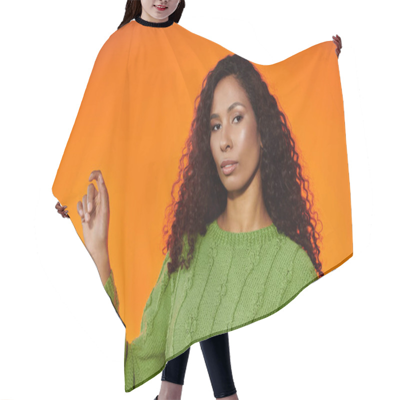 Personality  Woman In A Cozy Green Sweater Confidently Showcases Her Striking Features And Elegance. Hair Cutting Cape