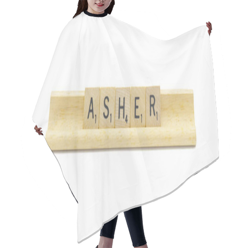 Personality  Miami, FL 4-18-24 Popular Baby Boy First Name Of Asher Made With Square Wooden Tile English Alphabet Letters With Natural Color And Grain On A Wood Rack Holder Isolated On White Background Hair Cutting Cape