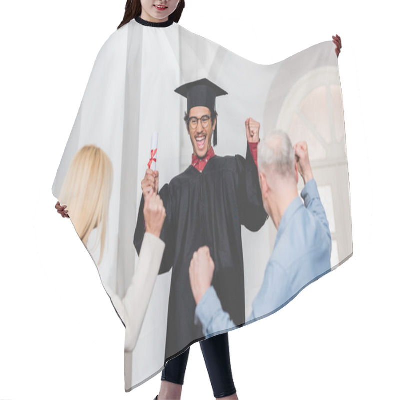 Personality  Back View Of Parents Gesturing Near Happy Son In Graduation Cap Holding Diploma  Hair Cutting Cape