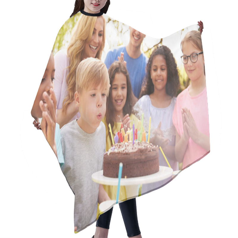 Personality  Boy Blows Out Candles As He Celebrates Birthday With Party For Parents And Friends In Garden At Home Hair Cutting Cape