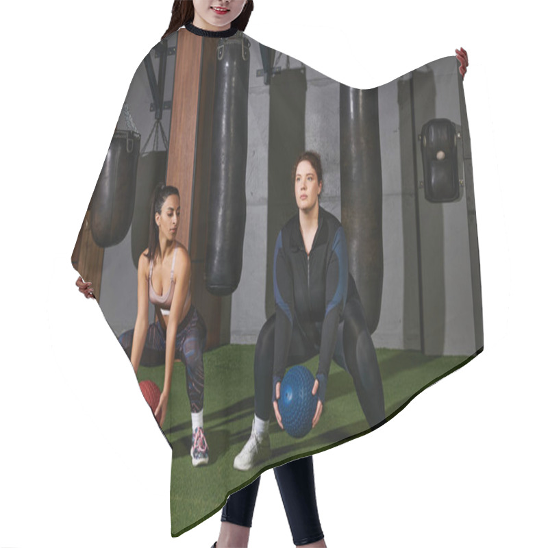 Personality  Two Dedicated Women Engage In A Challenging Fitness Routine With Weighted Balls In The Gym. Hair Cutting Cape