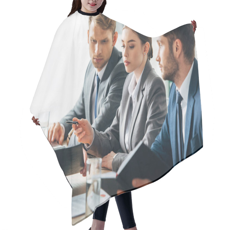 Personality  Selective Focus Of Recruiters Looking At Employee Showing Clipboard During Job Interview  Hair Cutting Cape