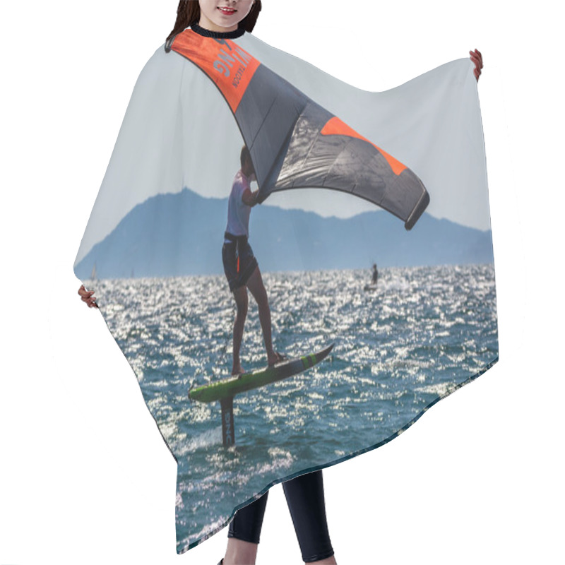 Personality  2021. Extreem Water Sports - Wing Foil, Kite Surfing, Wind Surfindg, Windy Day On Almanarre Beach Near Toulon, South Of France Hair Cutting Cape