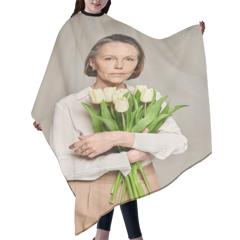 Personality  A Woman Gracefully Holds A Vibrant Bouquet Of Tulips. Hair Cutting Cape