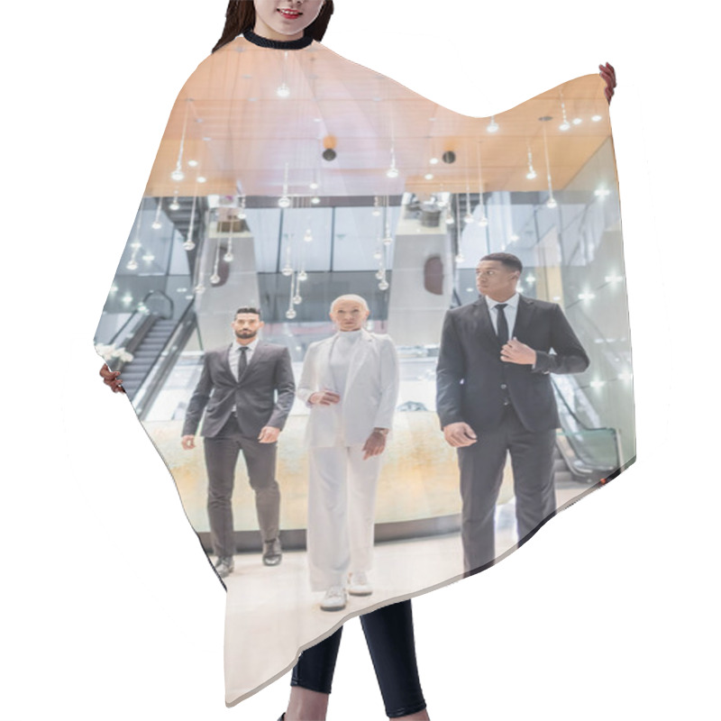 Personality  Full Length View Of Stylish Senior Business Lady Walking Near Private Interracial Bodyguards In Luxury Hotel Hair Cutting Cape