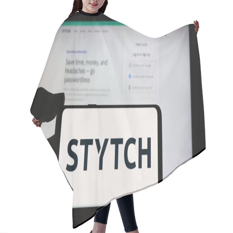 Personality  Stuttgart, Germany - 05-14-2024: Person Holding Cellphone With Logo Of US Identity Platform Company Stytch Inc. In Front Of Business Webpage. Focus On Phone Display. Hair Cutting Cape