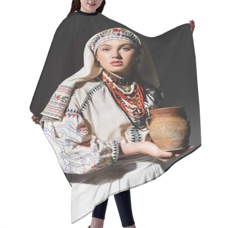 Personality  Portrait Of Young Ukrainian Woman In Traditional Clothing With Ornament Holding Clay Pot On Black Hair Cutting Cape