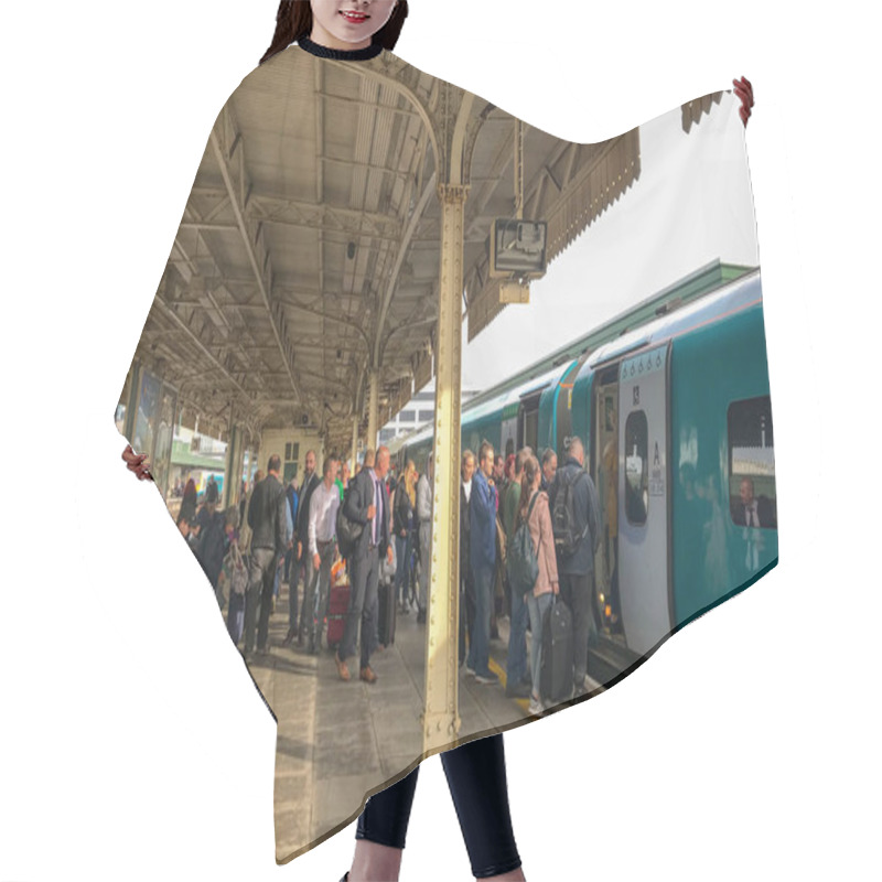 Personality  CARDIFF, WALES - OCTOBER 2018: Crowd Of Passengers Boarding A Commuter Train At Cardiff Central Station. Hair Cutting Cape