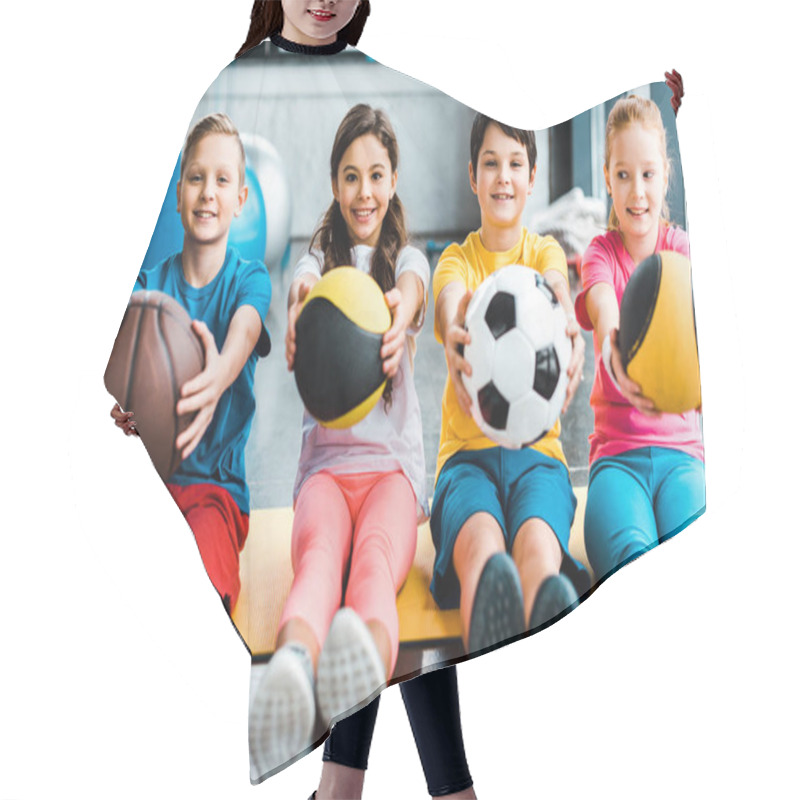 Personality  Cheerful Kids Sitting On Fitness Mat With Balls Hair Cutting Cape