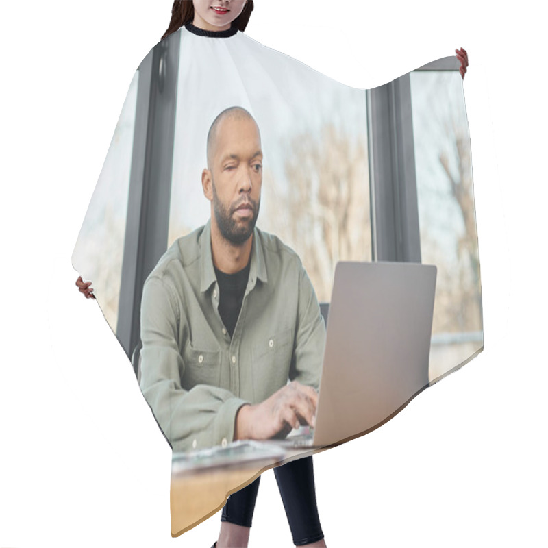 Personality  A Man With Myasthenia Gravis Sitting At A Desk, Focused On His Laptop Screen, Working On A Project In A Modern Office Setting. Hair Cutting Cape