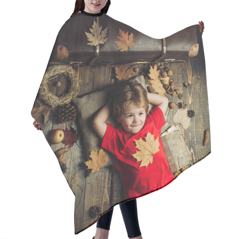 Personality  Smiling Little Boy Playing With Leaves. Smiling Little Boy Wearing In Fashionable Seasonal Clothes Having Autumnal Mood. Blonde Little Boy Resting With Leaf On Stomach Lies On Wooden Floor In Leaves. Hair Cutting Cape