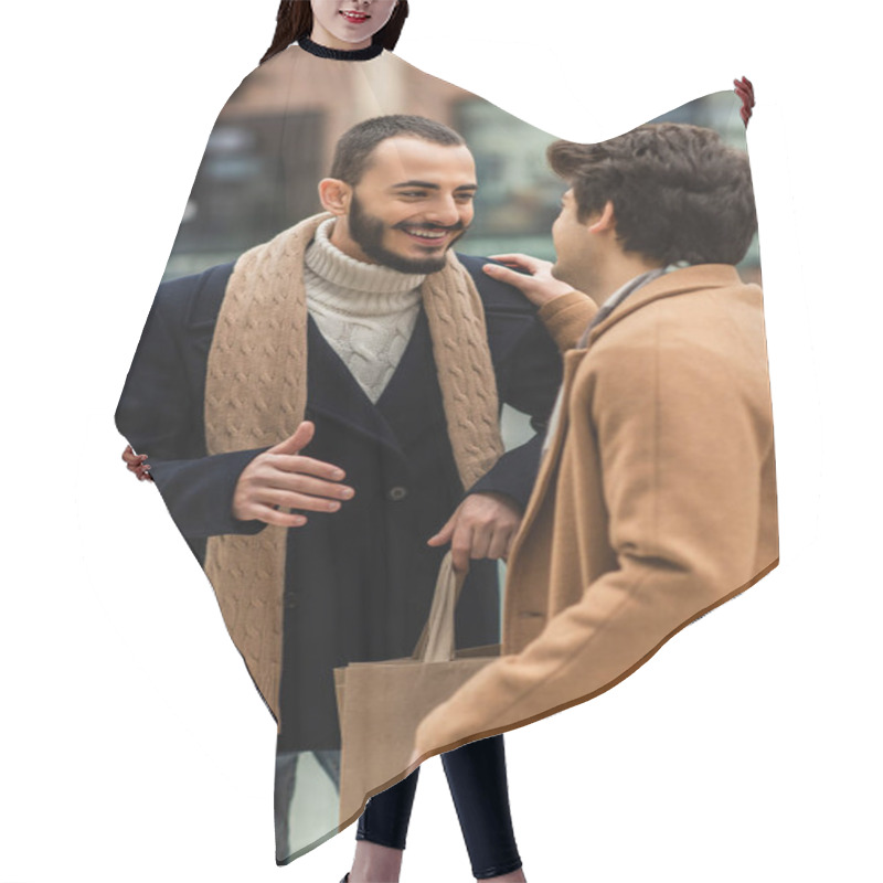 Personality  Cheerful Bearded Gay In Black Coat Holding Shopping Bags While Talking To Boyfriend Touching His Shoulder Hair Cutting Cape